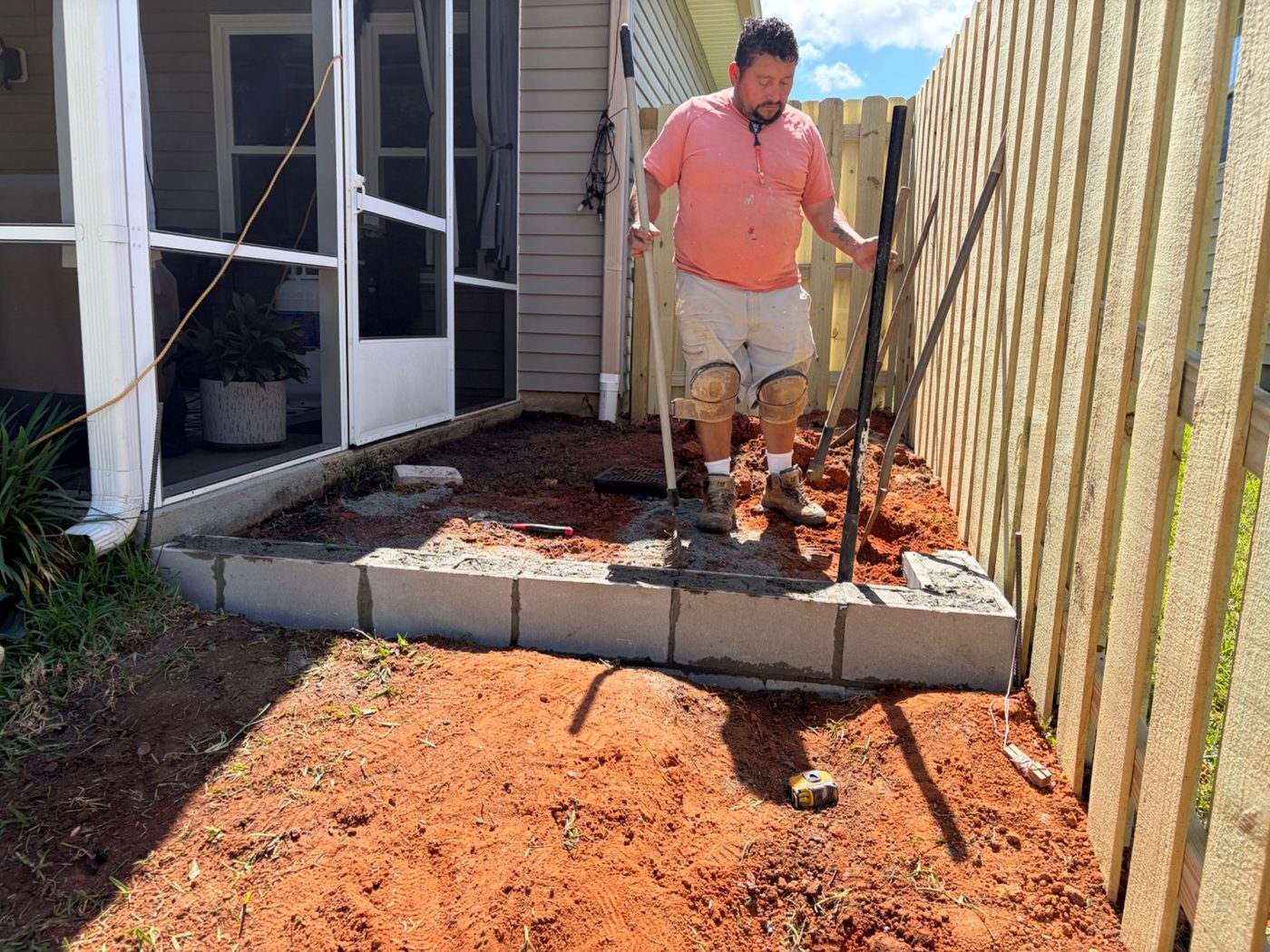 Patio under construction during base and wall prep.