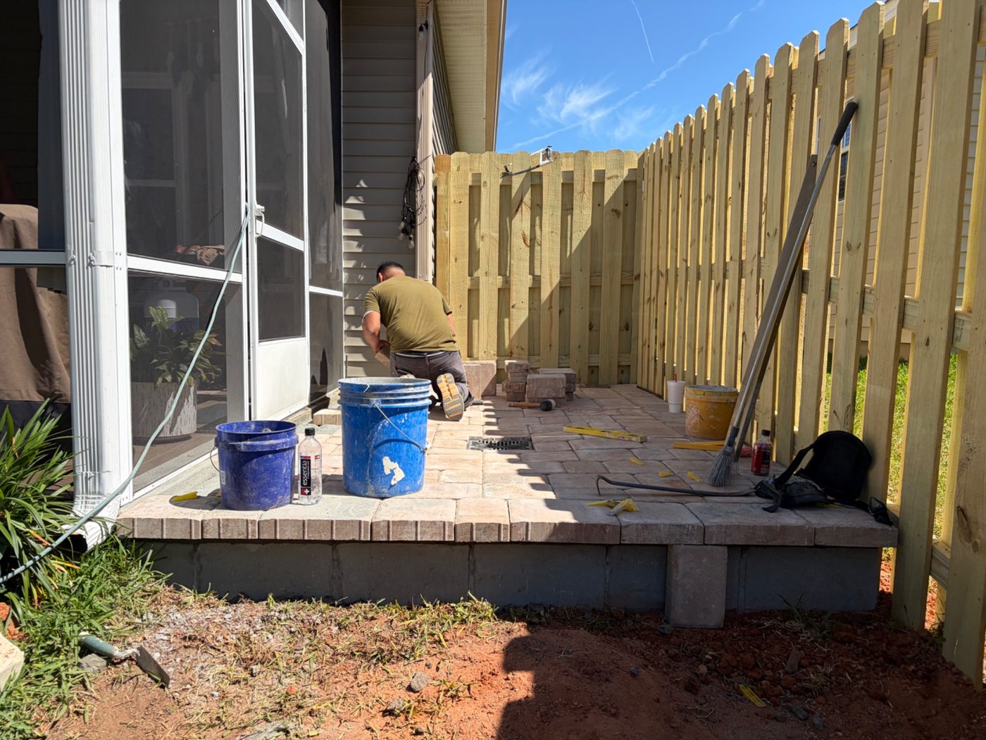 Paver patio installation in progress.